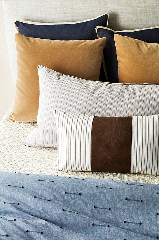 Materials such as velvet and leather cater to a love of luxury. Shown above: Lodi Linen Shams, Hazel Pillows in Putty Velvet, Sconset Sham, Emily Lumbar Pillow, and Lodi Fil Coupe Duvet Cover.
